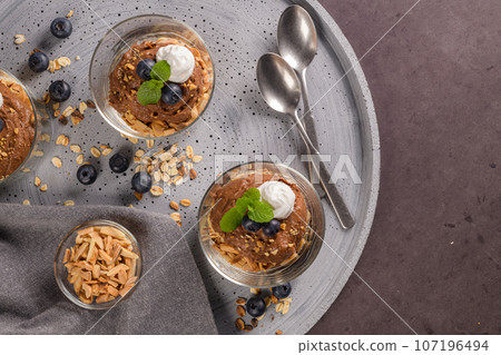 Glass cups of chocolate and chestnuts mousse Glass cups of chocolate and chestnuts mousse 107196494
