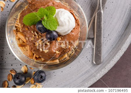 Glass cups of chocolate and chestnuts mousse Glass cups of chocolate and chestnuts mousse 107196495