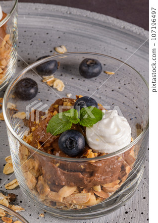Glass cups of chocolate and chestnuts mousse Glass cups of chocolate and chestnuts mousse 107196497