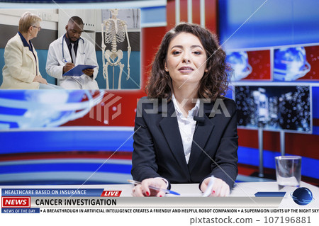 Presenter covers live healthcare news, discussing about medical insurance for patients and attempts to cure cancer. Anchorwoman reading headlines about scientific investigation. 107196881