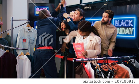 Black friday clients tired of waiting, angry obsessed shoppers eager to start shopping. Customers arguing with security employee, demanding to open store during seasonal sales. Black friday clients tired of waiting, angry obsessed shoppers eager to start shopping. Customers arguing with security employee, demanding to open store during seasonal sales. 107196915