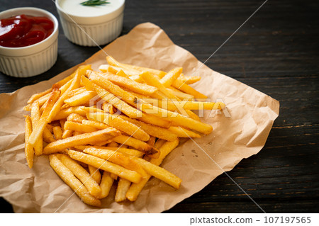 French fries with sour cream and ketchup 107197565