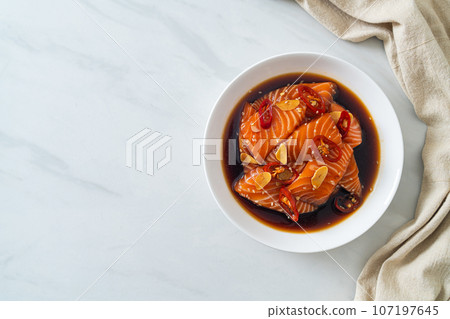 fresh salmon raw pickled in shoyu sauce fresh salmon raw pickled in shoyu sauce 107197645