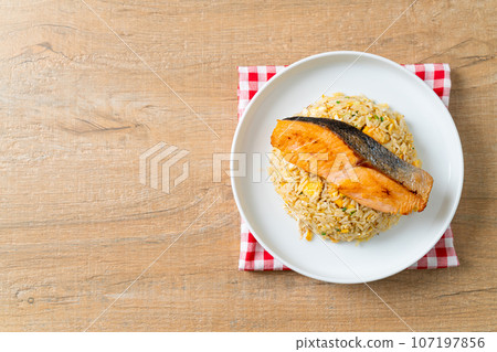 fried rice with grilled salmon fillet steak 107197856