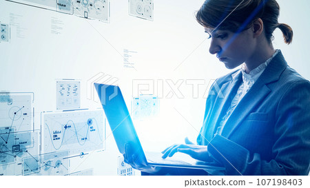 A woman using a personal computer and digital data 107198403