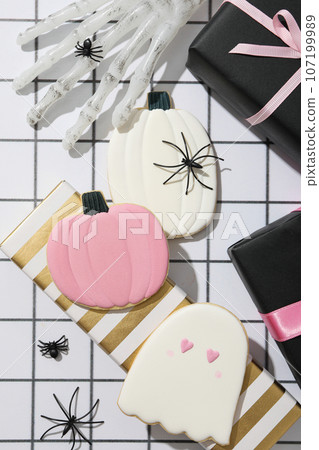 Cookies, marshmallows and brightly colored gifts for Halloween Cookies, marshmallows and brightly colored gifts for Halloween 107199989