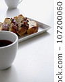Pound cake and coffee, white tableware, white background 107200060