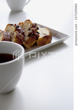 Pound cake and coffee, white tableware, white background Pound cake and coffee, white tableware, white background 107200060