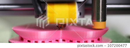 3D printer printing plastic part close up. 107200477