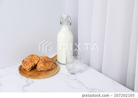 Breakfast tasty food concept - milk with bakery products 107202105