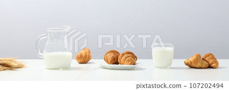 Breakfast tasty food concept - milk with bakery products 107202494