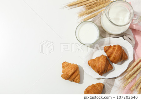 Breakfast tasty food concept - milk with bakery products 107202640