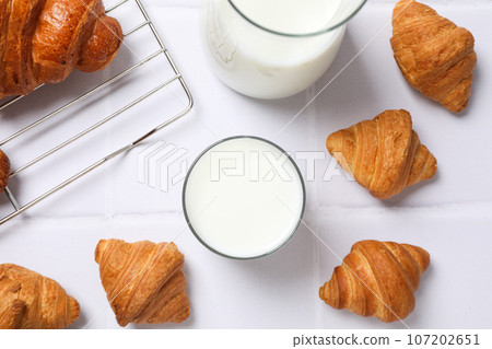 Breakfast tasty food concept - milk with bakery products 107202651