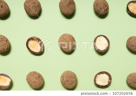 Tasty and sweet food - almonds in chocolate Tasty and sweet food - almonds in chocolate 107202656