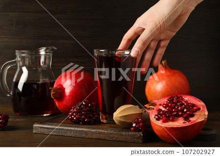 Pomegranate juice, delicious and fresh drink, tasty beverage Pomegranate juice, delicious and fresh drink, tasty beverage 107202927