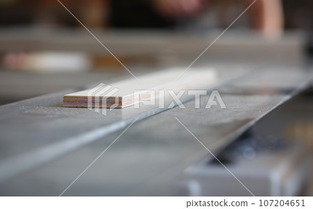 Wooden bars lying in a row closeup background 107204651