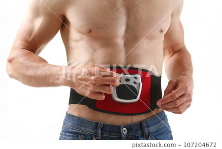 Athletic folded man uses an electric Athletic folded man uses an electric 107204672