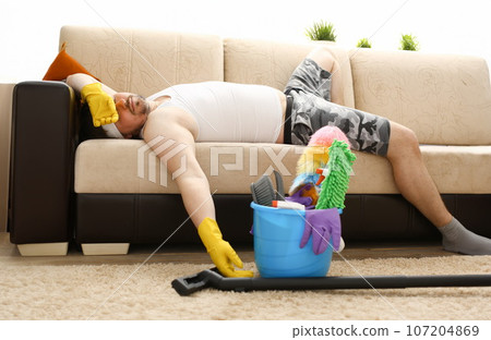 The man was left alone at home tired The man was left alone at home tired 107204869