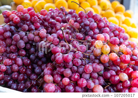 Ripe organic red grape in the product store Ripe organic red grape in the product store 107205017
