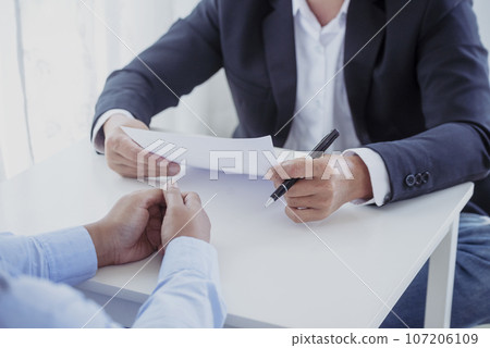 Business people job interview by HR officer shaking hands in office smiling face with happiness. Manager Businesswoman interview employee face to face sitting in meeting room. Job Interview Concept. 107206109