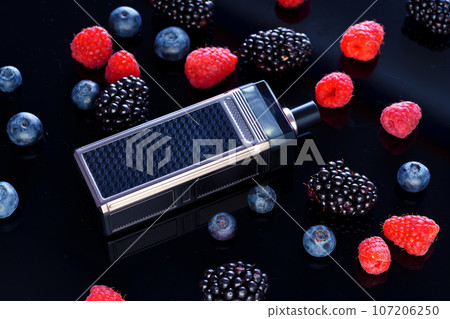 Vape smoking tool on black background with berries 107206250