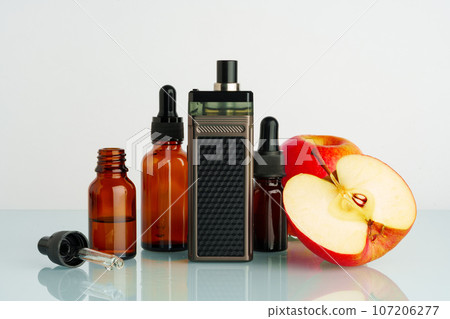 Vape liquid with apple flavor on white background Vape liquid with apple flavor on white background 107206277