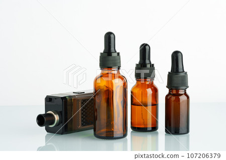 Electronic cigarette with smoking liquid bottle on white background 107206379