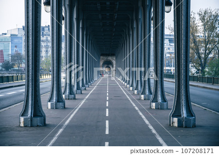 Long row of metal columns of elevated subway. Bir Hakeim Bridge in Paris, France Long row of metal columns of elevated subway. Bir Hakeim Bridge in Paris, France 107208171