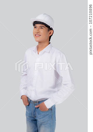 Portrait young asian man is engineer wearing helmet standing and smiling with confident isolated. 107210896