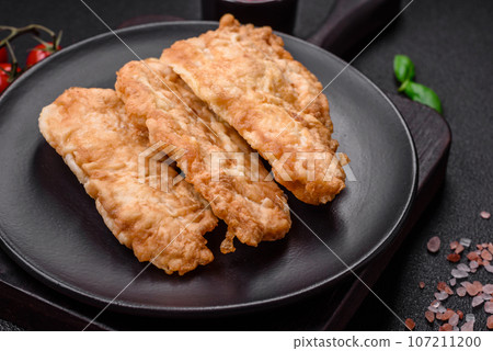 Delicious fried chicken chop or pork meat fried breaded with salt, spices and herbs Delicious fried chicken chop or pork meat fried breaded with salt, spices and herbs 107211200