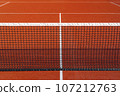 Black tennis net over a red playground 107212763