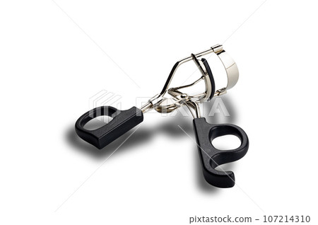 High angle view of single metal eyelash curler with black plastic handles isolated on white background. 107214310
