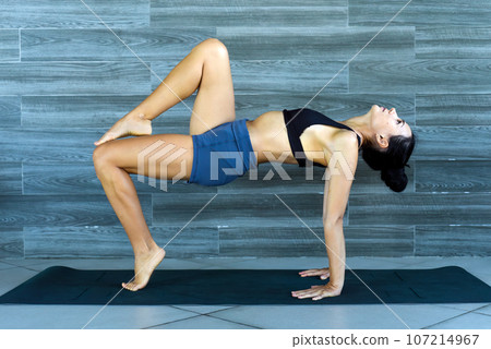 reverse table pose variation  ardha purvottasana yoga with ukrainian woman making it indoors 107214967
