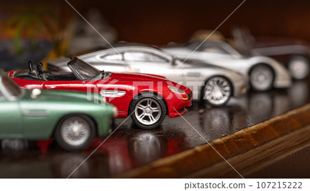 Retro car models on shelf. Retro car models on shelf. 107215222