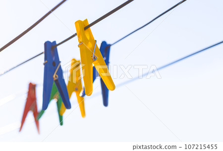 Plastic clothespins in different colors 107215455