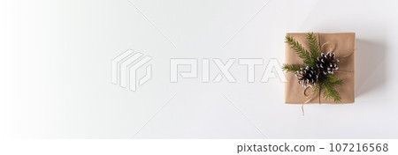 Gift box in craft paper gift for Christmas, New Year view top 107216568