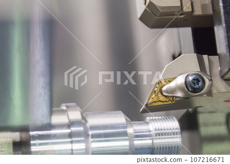 Close up scene the CNC lathe machine thread cutting at the end of metal pipe parts. 107216671