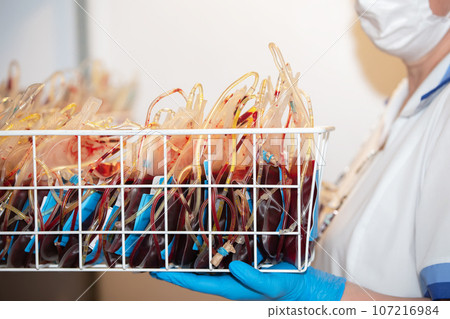 Packages with blood plasma in the center of donation and transfusiology. Material for blood transfusion. 107216984