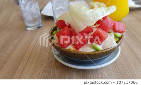 Fresh mix fruit and vegetable salad on ceramic bowl Healthy green salad with water melon, green beans, corn and lettuce Fresh mix fruit and vegetable salad on ceramic bowl Healthy green salad with water melon, green beans, corn and lettuce 107217066
