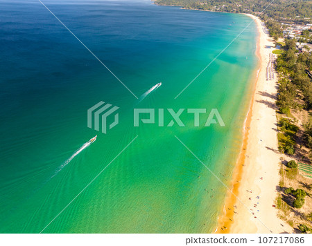 Summer sea nature background,Aerial view of Waves crashing on sandy shore,Sea surface ocean waves background 107217086