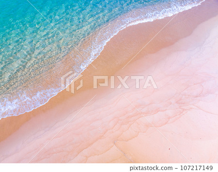 Waves crashing on sandy shore,Sea ocean waves background 107217149