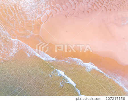 Waves crashing on sandy shore,Sea ocean waves background Waves crashing on sandy shore,Sea ocean waves background 107217158