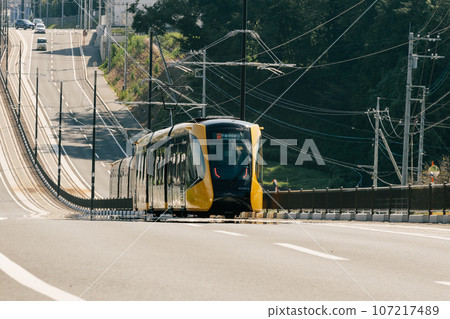 Utsunomiya light rail going up the hill Utsunomiya light rail going up the hill 107217489