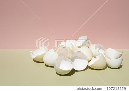 Cracked eggs shell. Easter creative still life. Cracked eggs shell. Easter creative still life. 107218259