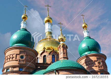 Three domes with crosses of the Orthodox Church, blue sky. Three domes with crosses of the Orthodox Church, blue sky. 107218355
