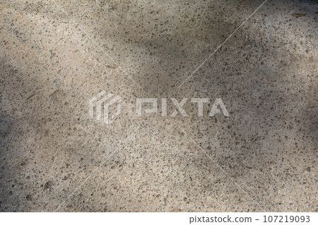 grunge outdoor polished concrete texture. Stained concrete texture. natural texture of cement. concrete in the sunshine 107219093