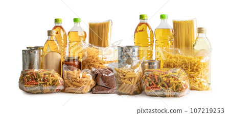 Foodstuff for donation, storage and delivery. Various food, pasta, cooking oil and canned food in cardboard box. 107219253