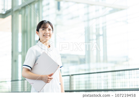 A young lady in white 107219458