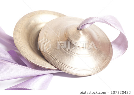 Hand cymbals isolated on white background. 107220423