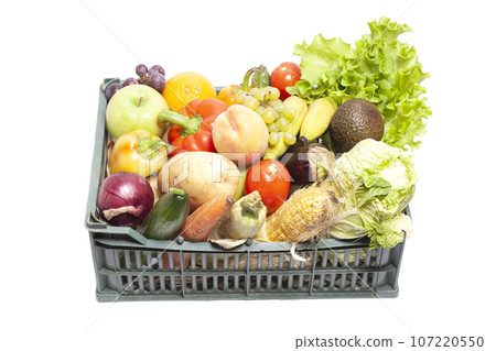 Fresh ripe vegetables and fruits in crate isolated on white background Fresh ripe vegetables and fruits in crate isolated on white background 107220550